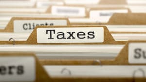 photo word taxes on file folder